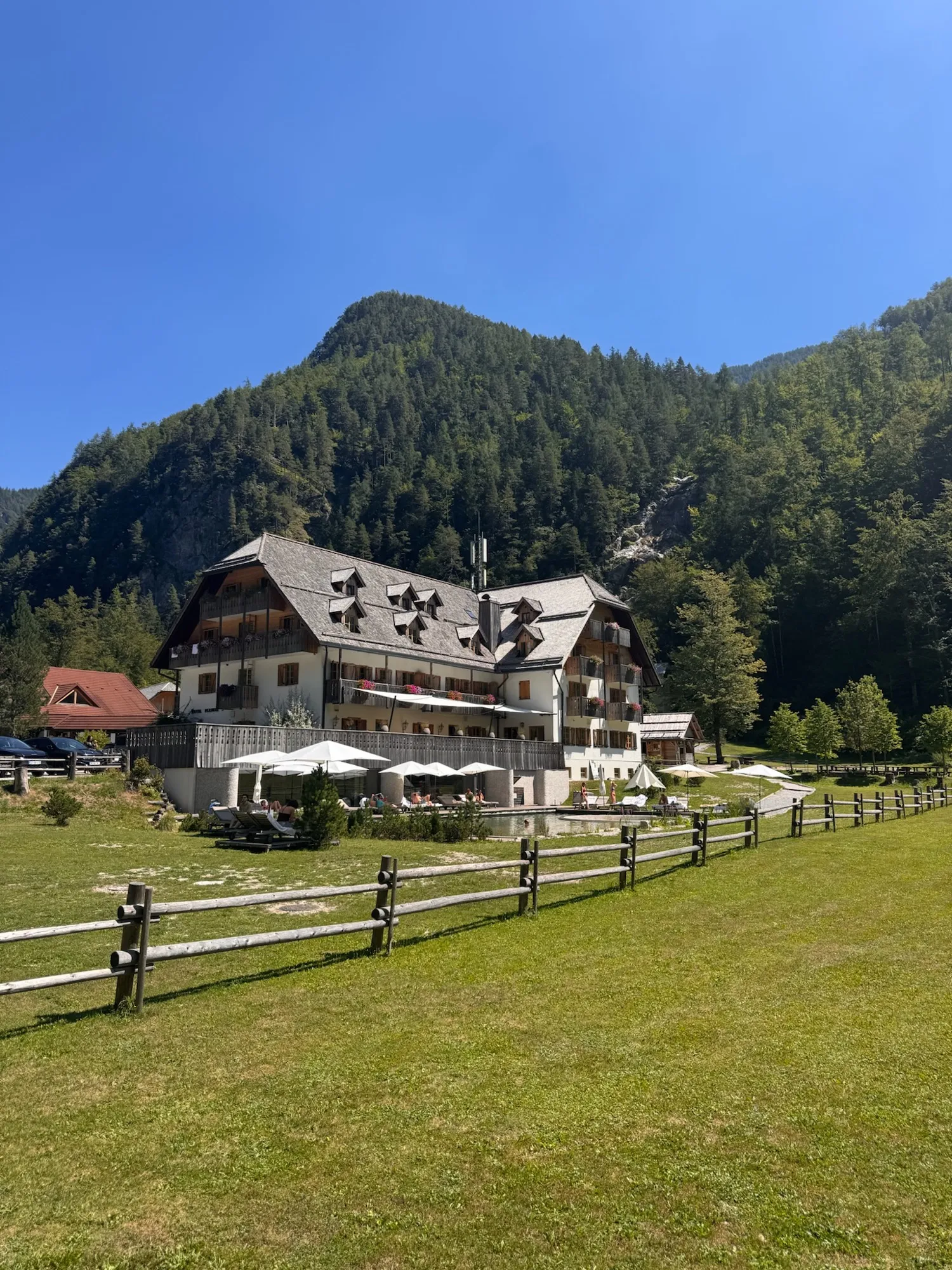 Hotel Plesnik below the forested slopes of the valley